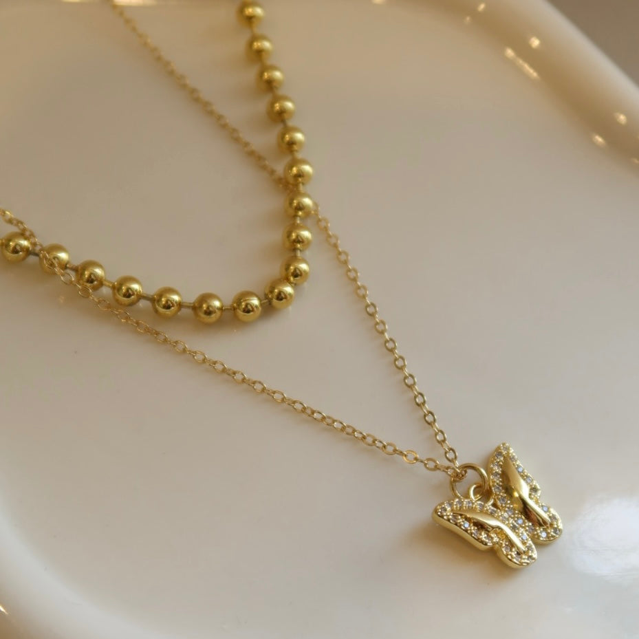 Collar doble Mariposa.